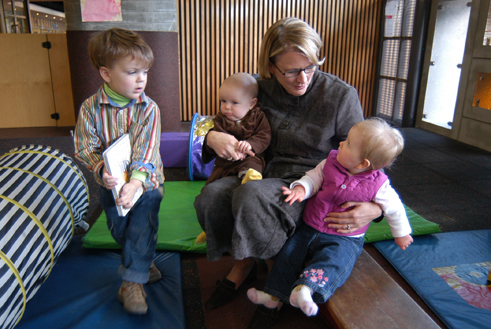 Photograph showing The Reserve Bank's participation in a joint-venture early childcare facility in the Sydney CBD. Children of Reserve Bank staff are shown with one of the parents (Stephanie Weston, Senior Manager, Payments Policy Department).