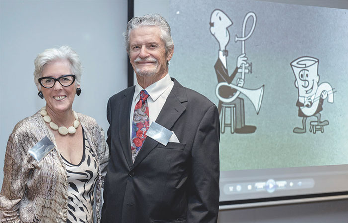 Pat Woolley, whose husband Ted Roberts wrote the lyrics to the conversion jingle, with Kevin Golsby, the voice of the animated character Dollar Bill, at the decimal currency event, February 2016;