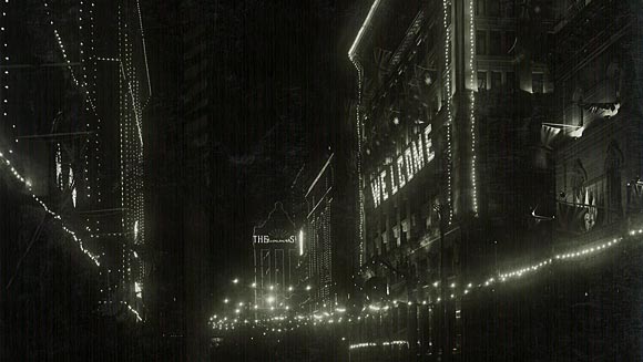 Photograph showing decorations by night on the Head Office building for the Prince of Wales’ visit to Australia, June 1920.