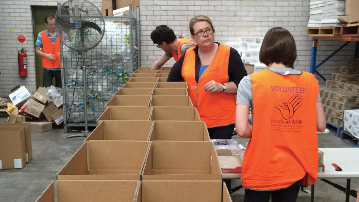 Several Reserve Bank staff volunteered to pack food orders and undertake general light warehouse duties at Foodbank's NSW distribution centre, December 2014